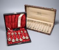 A cased set of silver teaspoons, a set of continental white metal cake forks and sundry mainly