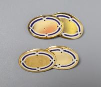 A pair of George V 18ct gold and two colour enamel oval cufflinks, gross 9.4 grams.