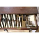 A Mappin & Webb part service of plated flatware in mahogany table canteen