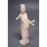 A Chinese carved coral figure of a lady, 10cm