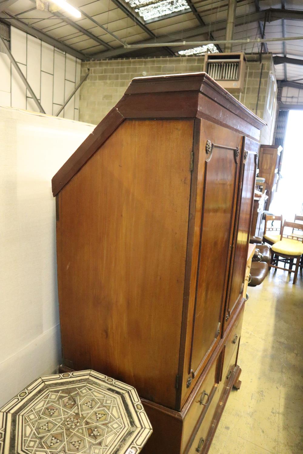 A Regency mahogany linen press, width 124cm, depth 60cm, height 192cm (top cut to fit eaves) - Image 2 of 2