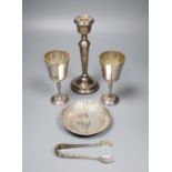 A pair of modern silver goblets, a silver candlestick, modern silver dis and pair of silver sugar