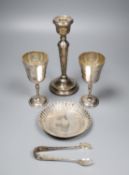 A pair of modern silver goblets, a silver candlestick, modern silver dis and pair of silver sugar