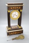 A 19th century inlaid French Portico mantel clock, with cast bacchus pendulum, 49cm