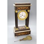 A 19th century inlaid French Portico mantel clock, with cast bacchus pendulum, 49cm