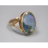 A 9ct and opal doublet set oval ring, size J, gross 2.7 grams.