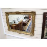 A rectangular gilt gesso wall mirror, width 85cm, height 62cm