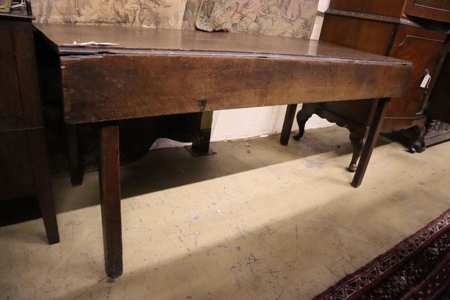 An 18th century provincial oak drop flap dining table, width 155cm, depth 66cm, height 71cm - Image 3 of 3