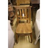 A set of four elm and beech provincial dining chairs