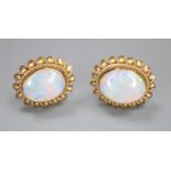 A modern pair of 9ct gold and white opal oval earrings, no butterflies, gross 1.1 grams.