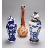 A Satsuma vase, 34cm, and two Chinese blue and white porcelain baluster jars and covers, all late