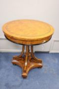 A reproduction circular Biedermeier style bird's eye maple centre table, 64cm diameter, 74cm high