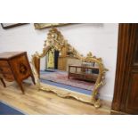 An 18th century style carved giltwood overmantel mirror, width 130cm, height 110cm