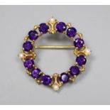 A modern 9ct gold, amethyst and seed pearl set openwork brooch, 25mm, gross 4.4 grams.