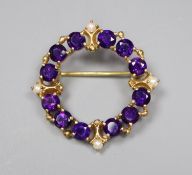 A modern 9ct gold, amethyst and seed pearl set openwork brooch, 25mm, gross 4.4 grams.
