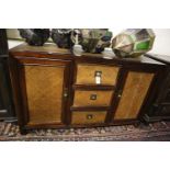 An Indian hardwood and rattan sideboard, width 140cm, depth 50cm, height 87cm