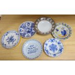 Seven various 18th century and later delft ware dishes, largest 24cm, some damage and a Studio