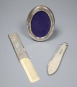 A silver-bladed and mother of pearl fruit knife and two other items, comprising a small comb in