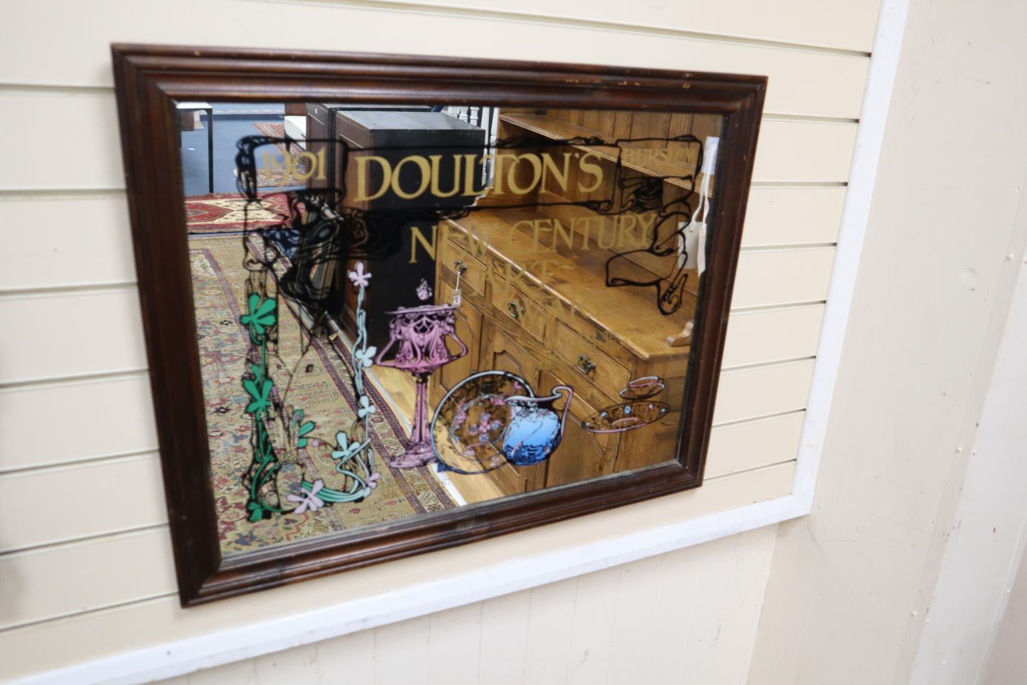 A reproduction Doulton Burslem advertising mirror, width 82cm, height 65cm