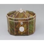 A George III silver mounted green stained tortoiseshell and ivory tea caddy, of decagonal form, with