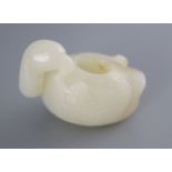 A Chinese white jade 'duck' brushwasher, the figure of the duck with his head turned to the left