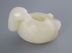 A Chinese white jade 'duck' brushwasher, the figure of the duck with his head turned to the left