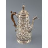 A late George II rococo tapered cylindrical coffee pot by Edward Aldridge, with pineapple finial and