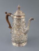 A late George II rococo tapered cylindrical coffee pot by Edward Aldridge, with pineapple finial and