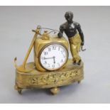 A 19th century French Empire bronze and ormolu mantel timepiece, modelled with a black sailor