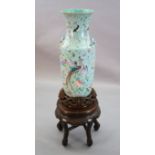 A large Chinese famille rose turquoise ground baluster vase, first half 19th century, painted with
