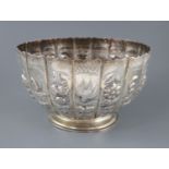A late Victorian embossed silver presentation punch bowl, by Thomas of New Bond Street, London,