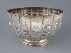 A late Victorian embossed silver presentation punch bowl, by Thomas of New Bond Street, London,