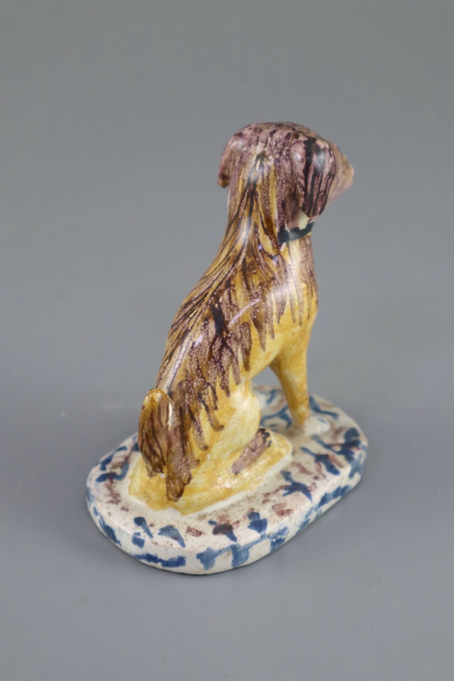 A Continental faience model of a seated dog, mid 18th century, possibly Brussels,CONDITION: - Image 4 of 6