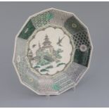 An unusual Chinese famille verte decorated biscuit porcelain twelve sided dish, 19th century in