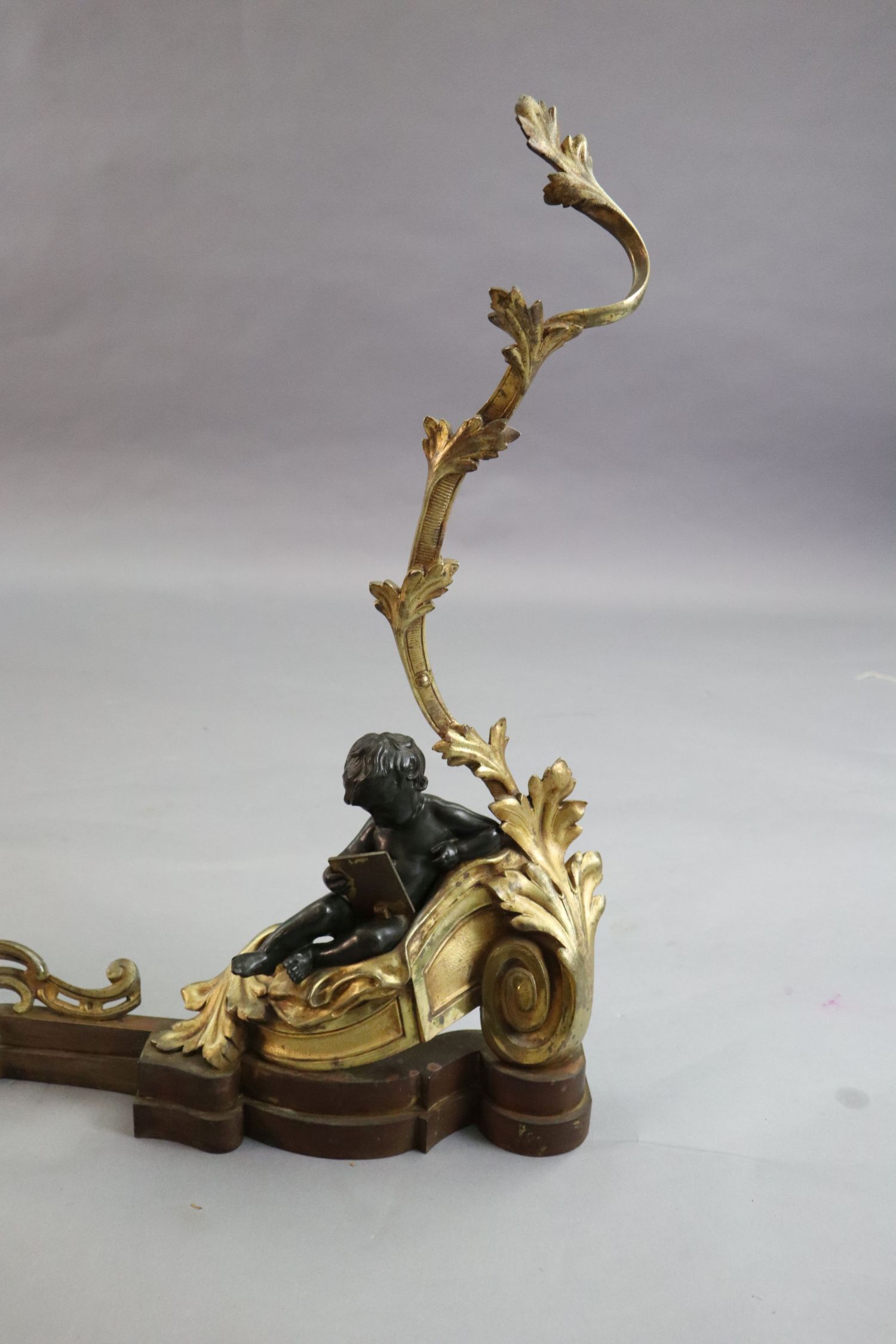 A Louis XVI style bronze and ormolu fender, with putto and foliate scroll terminals, length 48in. - Image 2 of 5