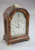 Delasalle of London. A George III mahogany eight day bracket clock, the arched silvered dial with