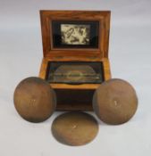 A Victorian German walnut symphonion, with stencil decorated lid and gilt bronze handles, the