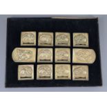 A set of twelve Chinese gilt bronze belt plaques, Tang-Liao dynasty or later, each cast in relief