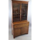 A late George III mahogany secretaire bookcase with moulded cornice and two astragal glazed doors