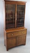 A late George III mahogany secretaire bookcase with moulded cornice and two astragal glazed doors