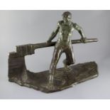 Victor Demanet (1895-1964). A bronze figure of a barge man operating a lock gate, with blued green