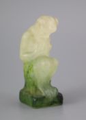 An Amalric Walter pate de verre seated figure of Pan, in green and white frosted glass, signed A.