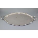 A George V silver shaped oval two handled tea tray, by Henry Stratford Ltd, Sheffield, 1912, 68.8cm,