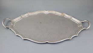 A George V silver shaped oval two handled tea tray, by Henry Stratford Ltd, Sheffield, 1912, 68.8cm,