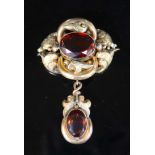 A Victorian engraved gold and two stone oval cut citrine set scrolling drop brooch, 8cm, gross 20.