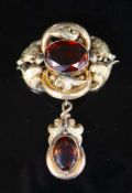 A Victorian engraved gold and two stone oval cut citrine set scrolling drop brooch, 8cm, gross 20.