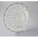 A Georgian rib moulded glass dish, mid 18th century, with applied trailing foot, 22cm