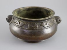 A Chinese bronze gui censer, Xuande mark but later, the compressed ovoid body cast in relief with