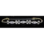 A 1920's gold and platinum, diamond and black onyx set bracelet, approx. 16cm, with star motifs