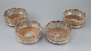 A good set of four early Victorian pierced silver wine coasters, by Joseph Angell I and Joseph
